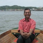 Boating at Brunei River near Floating Villages