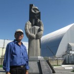 Chernobyl Monument near covered Reactor that exploded